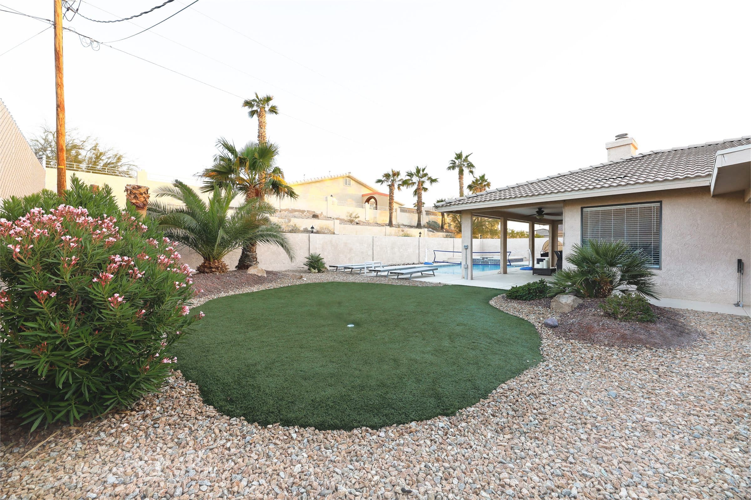 Backyard with pool, spa, and lounge space