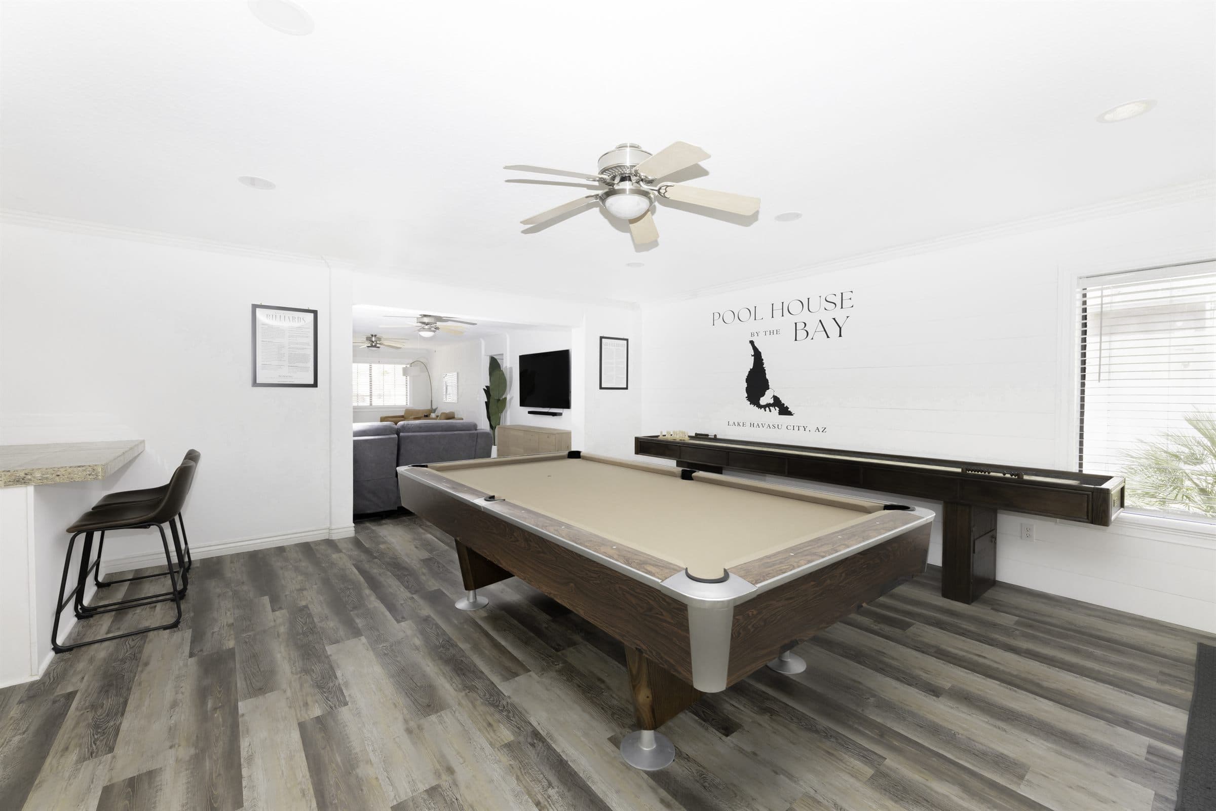 Game room with billiards and shuffleboard